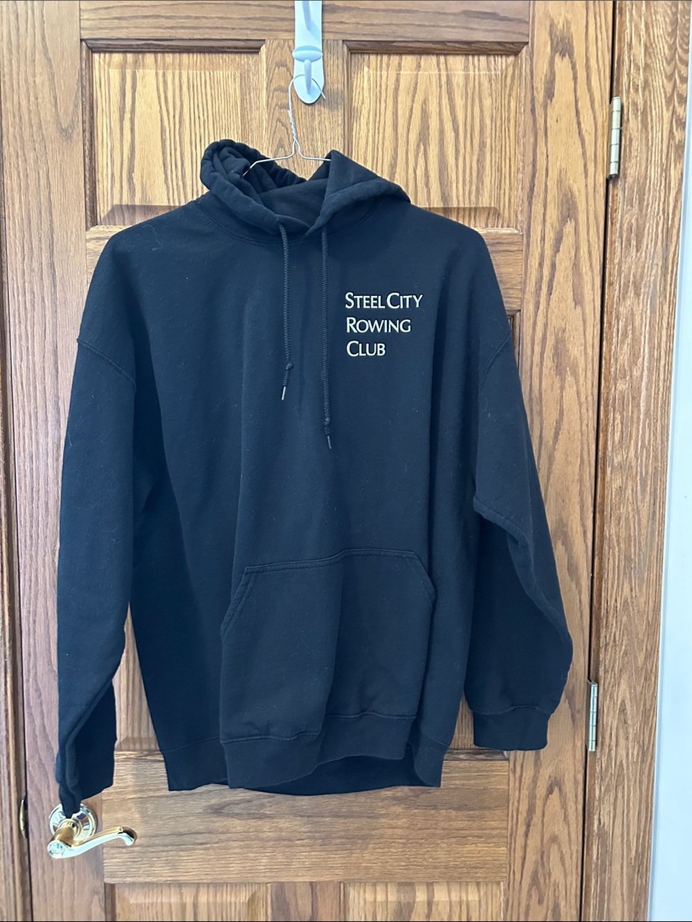 Comfortable hoodie with a bold steel city ￼rowing club graphic.